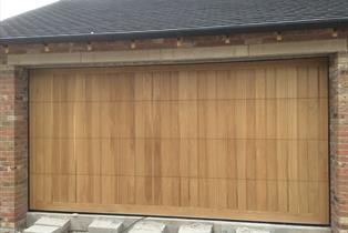 bespoke solid oak sectional door natural finish